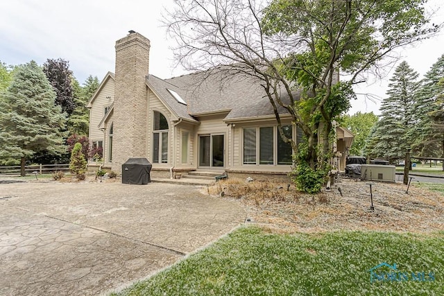 7559 Peachtree Ln, Sylvania, OH 43560 - rear view of house featuring a chimney, a patio, and a shingled roof