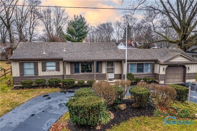 4538 Vineyard Rd, Toledo, OH 43623 - ranch-style house featuring a garage, roof with shingles, and asphalt driveway