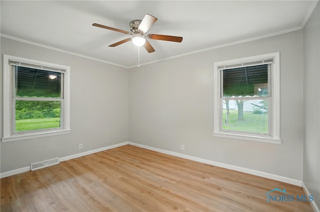 130 Vine St, Risingsun, OH 43457 - spare room with crown molding, baseboards, ceiling fan, and light wood finished floors