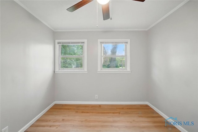 130 Vine St, Risingsun, OH 43457 - spare room featuring ceiling fan, baseboards, crown molding, and light wood-type flooring