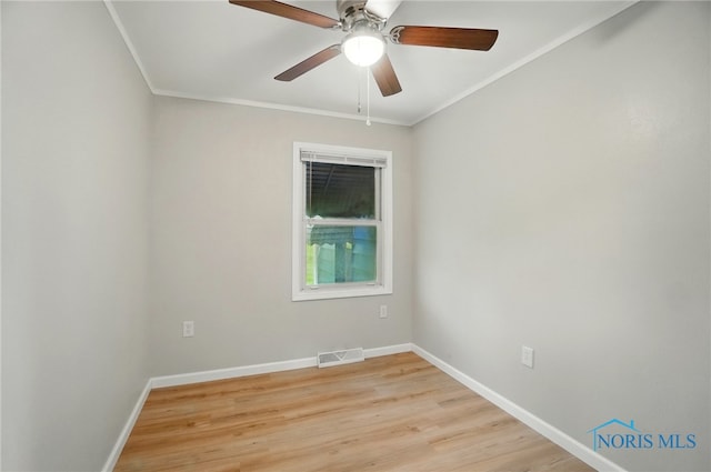 130 Vine St, Risingsun, OH 43457 - empty room featuring baseboards, ornamental molding, light wood-style flooring, and ceiling fan
