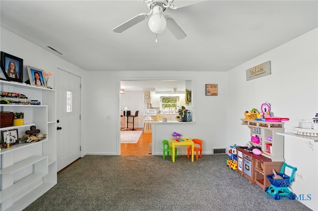18827 State Route 2, Wauseon, OH 43567 - recreation room with carpet flooring, a ceiling fan, and baseboards