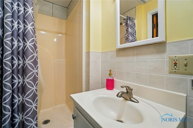 18827 State Route 2, Wauseon, OH 43567 - bathroom with a shower stall, vanity, and tile walls