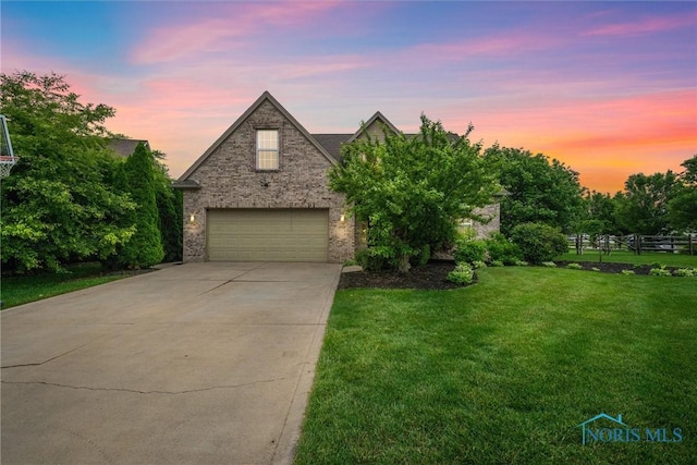12158 Jefferson St, Perrysburg, OH 43551 - traditional-style home featuring a front lawn, concrete driveway, an attached garage, and brick siding