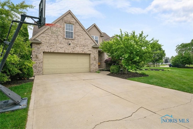 12158 Jefferson St, Perrysburg, OH 43551 - view of front of house with brick siding, a front lawn, driveway, and a garage