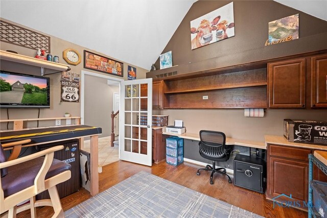 12158 Jefferson St, Perrysburg, OH 43551 - office with french doors, wood finished floors, built in study area, and high vaulted ceiling