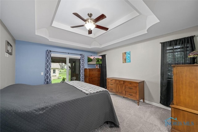 12158 Jefferson St, Perrysburg, OH 43551 - bedroom featuring a raised ceiling, light carpet, ceiling fan, and baseboards