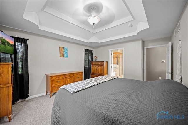 12158 Jefferson St, Perrysburg, OH 43551 - bedroom with a tray ceiling, light carpet, and connected bathroom