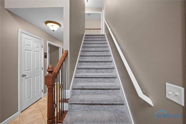 12158 Jefferson St, Perrysburg, OH 43551 - stairway featuring tile patterned floors and baseboards
