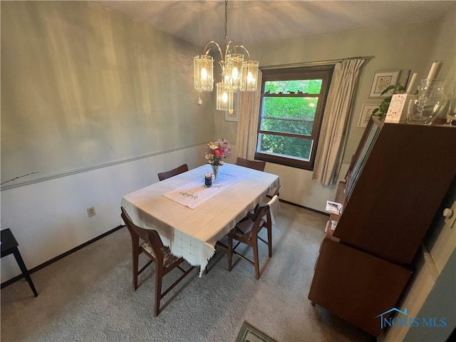 828 Louisiana Ave, Perrysburg, OH 43551 - dining space featuring a chandelier, carpet flooring, and baseboards