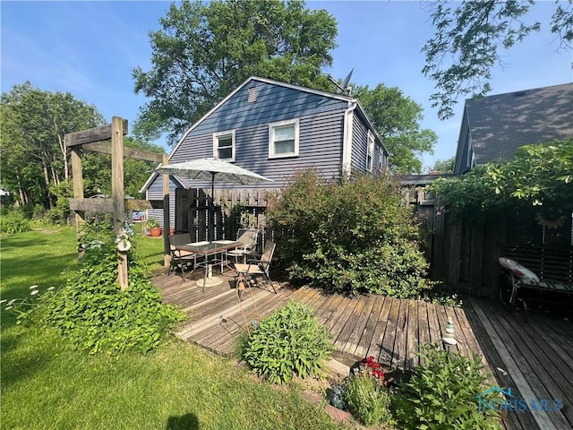 828 Louisiana Ave, Perrysburg, OH 43551 - rear view of house featuring a deck, a yard, and outdoor dining area