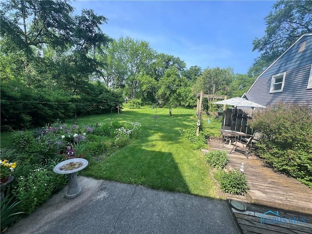 828 Louisiana Ave, Perrysburg, OH 43551 - view of green lawn featuring a wooden deck