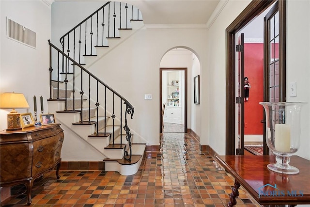 3534 Edgevale Rd, Ottawa Hills, OH 43606 - entrance foyer with arched walkways, crown molding, baseboards, and stairs