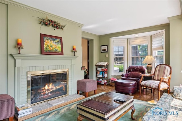 3534 Edgevale Rd, Ottawa Hills, OH 43606 - living area featuring ornamental molding, a brick fireplace, and wood finished floors
