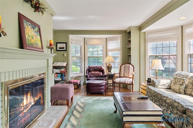 3534 Edgevale Rd, Ottawa Hills, OH 43606 - living room featuring wood finished floors, a brick fireplace, crown molding, healthy amount of natural light, and baseboards