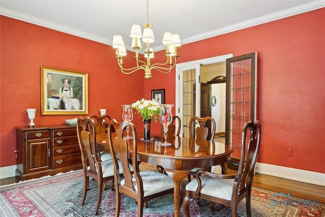3534 Edgevale Rd, Ottawa Hills, OH 43606 - dining area with a chandelier, wood finished floors, and baseboards