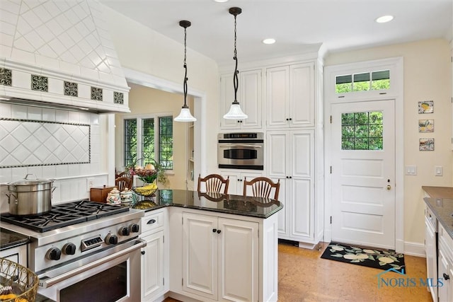 3534 Edgevale Rd, Ottawa Hills, OH 43606 - kitchen with stainless steel appliances, decorative backsplash, plenty of natural light, white cabinets, and recessed lighting