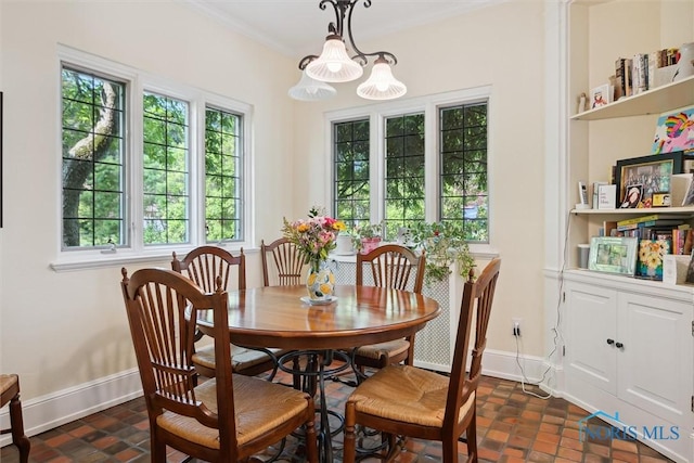 3534 Edgevale Rd, Ottawa Hills, OH 43606 - dining area with baseboards, crown molding, and brick patterned flooring