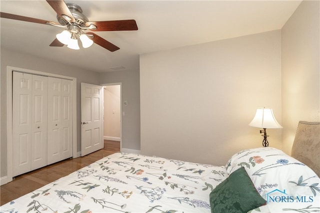 7915 W Bancroft St, Toledo, OH 43617 - bedroom featuring baseboards, wood finished floors, ceiling fan, and a closet