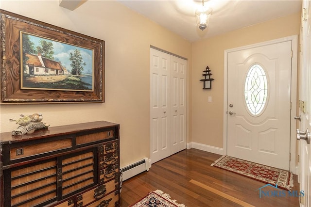 7915 W Bancroft St, Toledo, OH 43617 - foyer entrance with a baseboard heating unit, dark wood finished floors, and baseboards