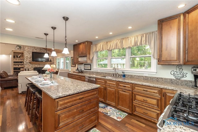 7915 W Bancroft St, Toledo, OH 43617 - kitchen with a sink, open floor plan, brown cabinetry, dark wood finished floors, and recessed lighting