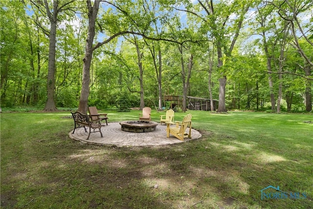 7915 W Bancroft St, Toledo, OH 43617 - view of green lawn featuring an outdoor fire pit