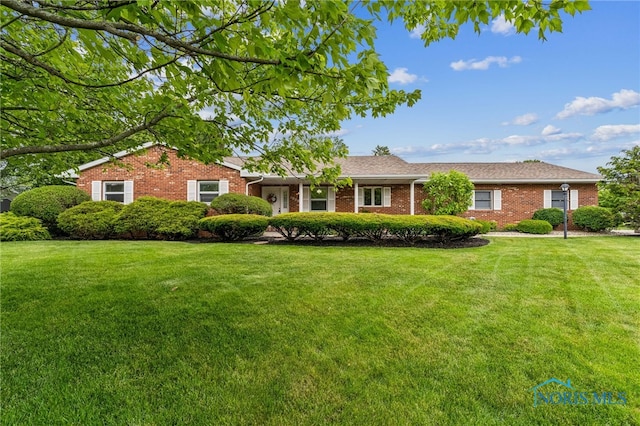 1008 Muirfield Dr, Findlay, OH 45840 - single story home with a front lawn and brick siding