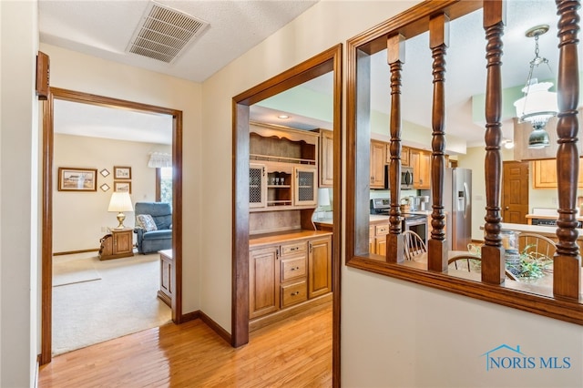 1008 Muirfield Dr, Findlay, OH 45840 - corridor with light wood-style floors and baseboards