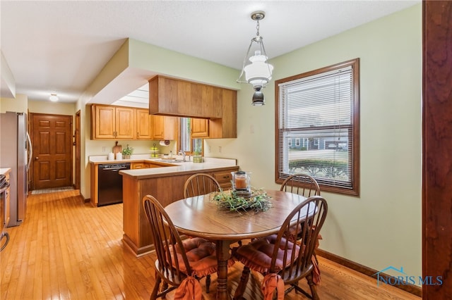 1008 Muirfield Dr, Findlay, OH 45840 - dining area with light wood-style floors and baseboards