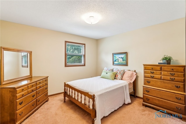 1008 Muirfield Dr, Findlay, OH 45840 - bedroom featuring light colored carpet, a textured ceiling, and baseboards