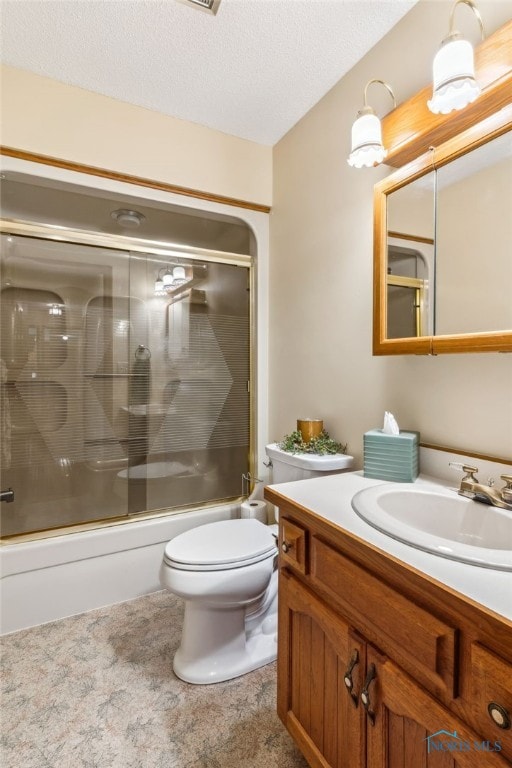 1008 Muirfield Dr, Findlay, OH 45840 - full bath with enclosed tub / shower combo, vanity, a textured ceiling, and toilet