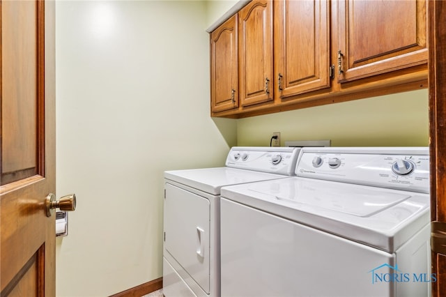 1008 Muirfield Dr, Findlay, OH 45840 - laundry room with washing machine and clothes dryer and cabinet space