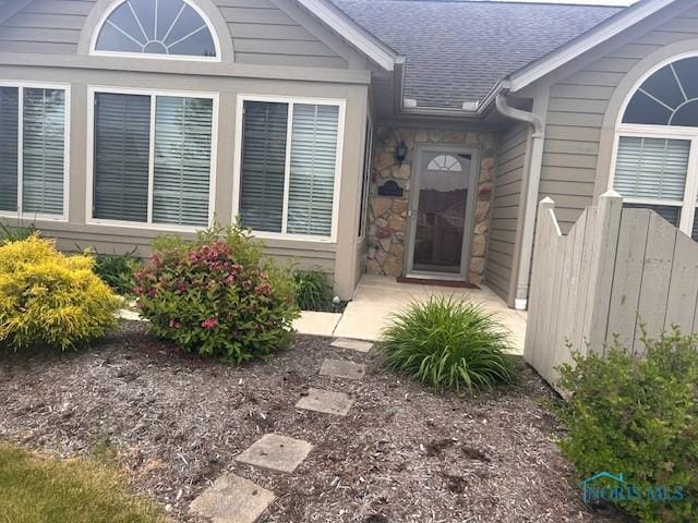 15337 S Watermark Dr Unit 15337, Findlay, OH 45840 - view of exterior entry with roof with shingles