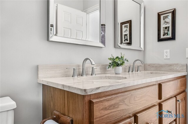 8832 Orchard Lake Rd, Holland, OH 43528 - bathroom with toilet and double vanity