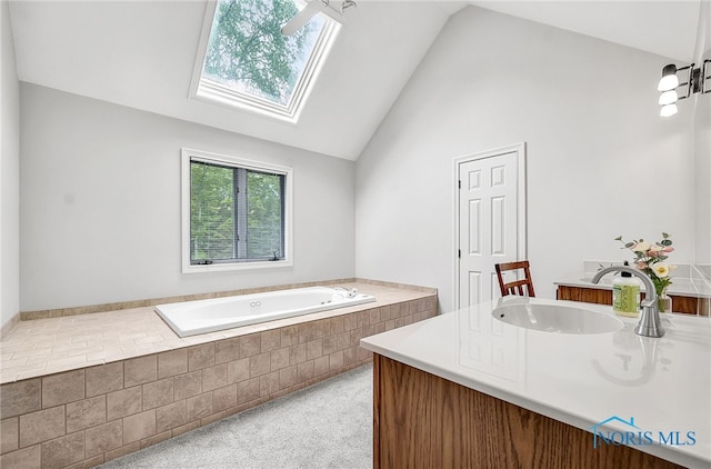 8832 Orchard Lake Rd, Holland, OH 43528 - full bathroom with a skylight, a garden tub, vaulted ceiling, and vanity