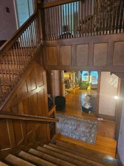 2267 Robinwood Ave, Toledo, OH 43620 - staircase with wood finished floors and a high ceiling