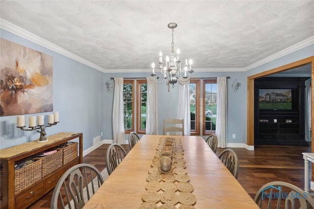 25581 Normandy Rd, Perrysburg, OH 43551 - dining area featuring dark wood finished floors, a chandelier, baseboards, and ornamental molding