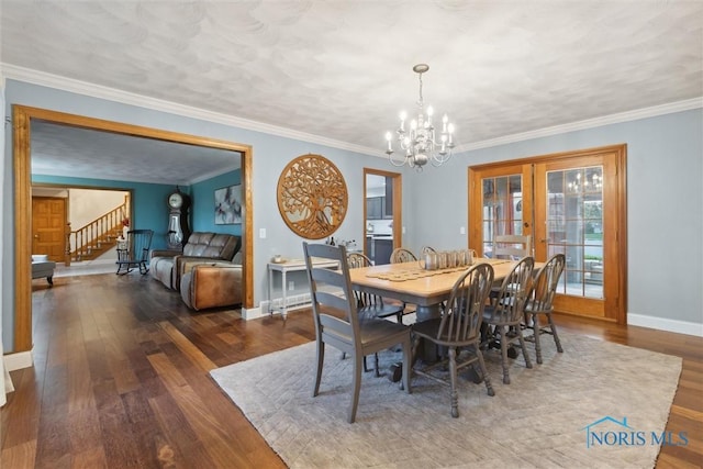 25581 Normandy Rd, Perrysburg, OH 43551 - dining space with french doors, wood-type flooring, a chandelier, stairway, and crown molding