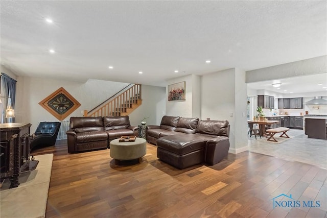 25581 Normandy Rd, Perrysburg, OH 43551 - living room with light wood-type flooring, stairs, recessed lighting, and baseboards