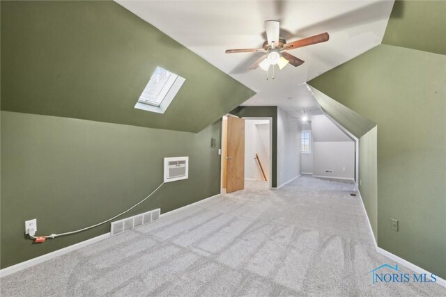 25581 Normandy Rd, Perrysburg, OH 43551 - additional living space with a skylight, lofted ceiling, carpet flooring, a ceiling fan, and baseboards