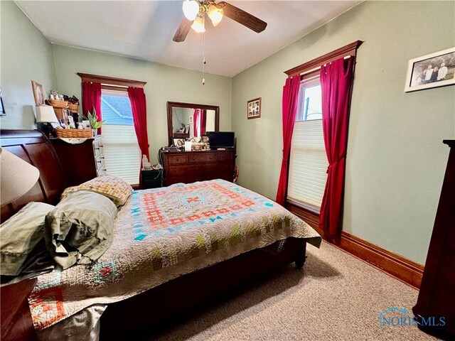 118 N Maple St, Hicksville, OH 43526 - carpeted bedroom with baseboards and a ceiling fan
