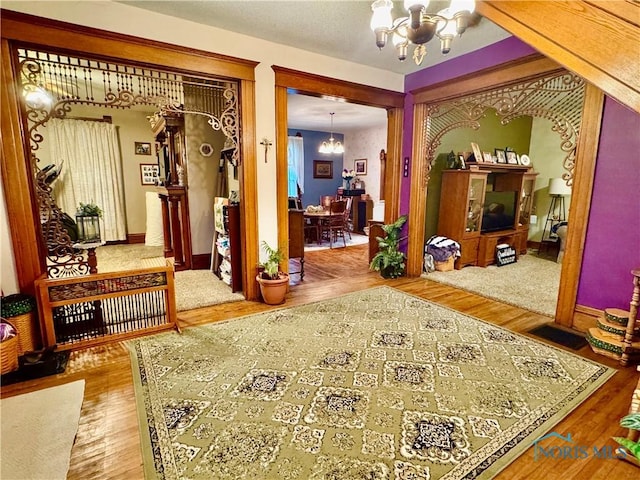 118 N Maple St, Hicksville, OH 43526 - entrance foyer featuring a chandelier, wood finished floors, and baseboards
