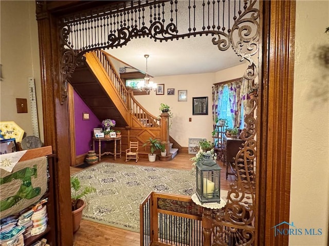 118 N Maple St, Hicksville, OH 43526 - living area with stairway, wood finished floors, and a chandelier