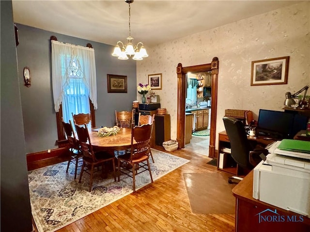 118 N Maple St, Hicksville, OH 43526 - dining space with light wood-style floors, a chandelier, and an office area