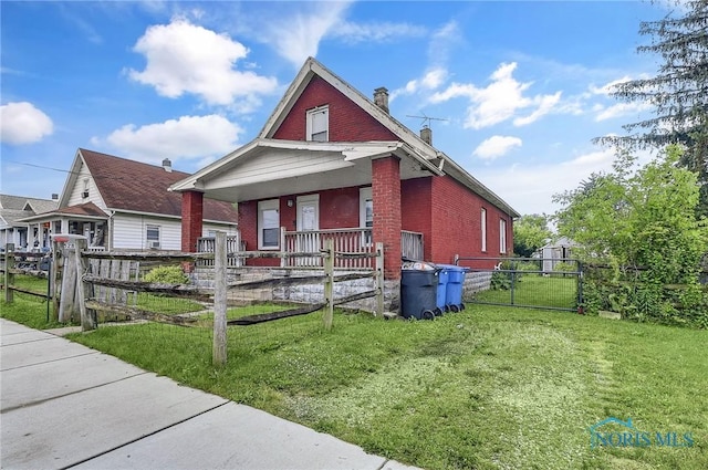 1528 Hirzel St, Toledo, OH 43605 - view of front of property with covered porch, brick siding, and a chimney