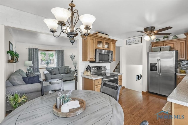 1796 Bucklew Dr, Toledo, OH 43613 - dining area featuring a chandelier, dark wood-style floors, and ceiling fan