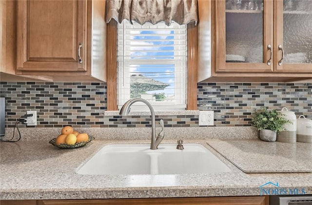 1796 Bucklew Dr, Toledo, OH 43613 - kitchen view of light countertops, glass insert cabinets, and decorative backsplash