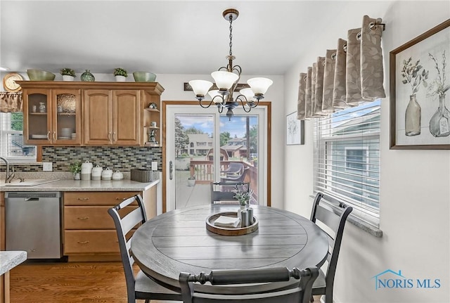 1796 Bucklew Dr, Toledo, OH 43613 - dining area with a chandelier, healthy amount of natural light, and light wood-style flooring