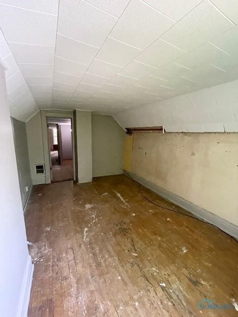 3223 Maple St, Toledo, OH 43608 - additional living space featuring hardwood / wood-style flooring, vaulted ceiling, and heating unit