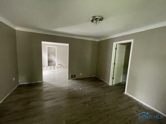 3223 Maple St, Toledo, OH 43608 - empty room with crown molding, wood finished floors, and baseboards